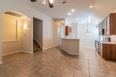The cheerful kitchen is open to the living area.
