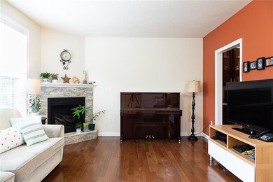 Living room with beautiful fireplace done in a mos