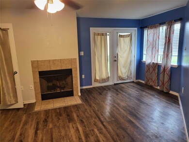 Unfurnished living room with ceiling fan, dark har