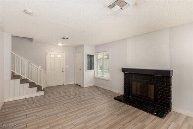 Entrance foyer with wood finished floors, a textur