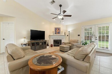 French doors open to backyard patio.