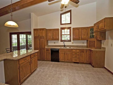 Kitchen. Vaulted Ceilings, Granite, Stainless, and