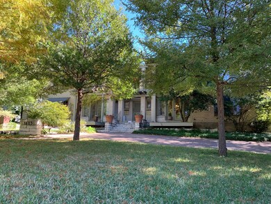 View of property hidden behind natural elements f