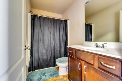 Bathroom with visible vents, toilet, curtained sho