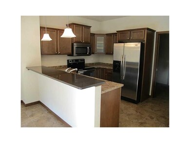 Kitchen. quartz brk bar,tile flooring, stainless a