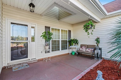 View of exterior entry with covered porch