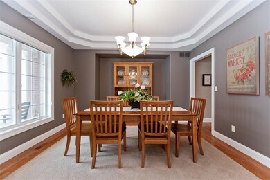 Fresh paint with inlaid carpet and hardwood floor.