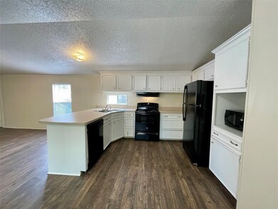 Kitchen has plenty of counters and cabinets and all appliances included.