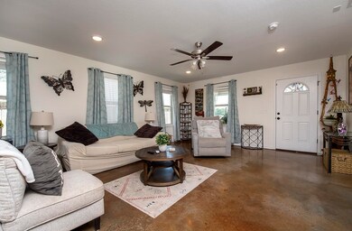 The main living quarters are enveloped in windows for natural light.