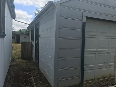 In between the house and detached garage to the ri