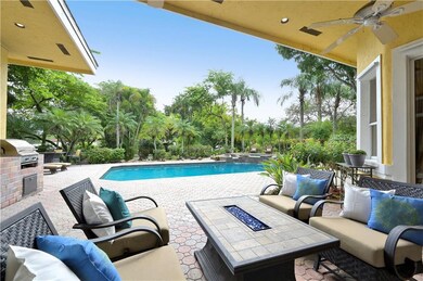 Generous covered patio with fire pit, brick summer