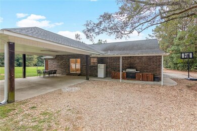 Back of house with carport