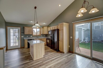 One of the few twin homes with a side patio door to your grilling space!