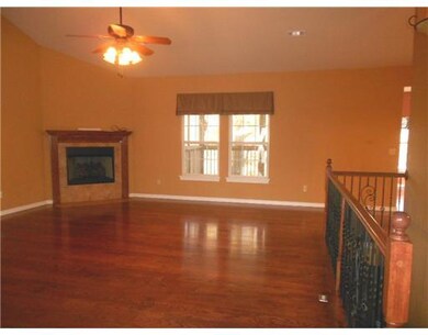 Living Room. Wood floors, vaulted ceilings, tile t