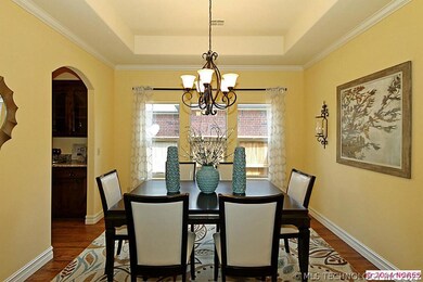 Formal dining with tray ceiling and access to butl