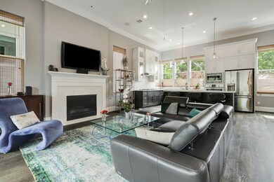 The open floor plan features high ceilings, recess