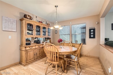Dining room featuring light wood finished floors a