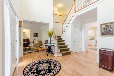 Two-story foyer open to the dining room, kitchen/g