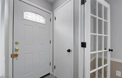 Entryway featuring french doors