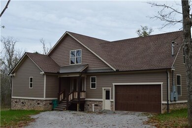 Garage and entrance to eat-in kitchen