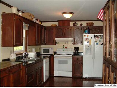Kitchen features granite countertops, nice cabinet