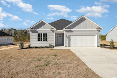View of front facade featuring a garage