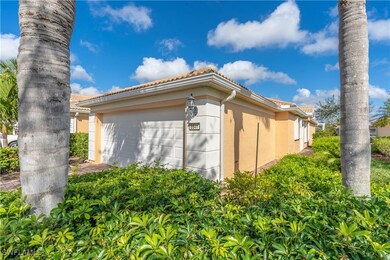View of side of property with a garage
