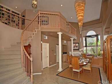 Formal Entry and Dining Room with a Grand Staircas