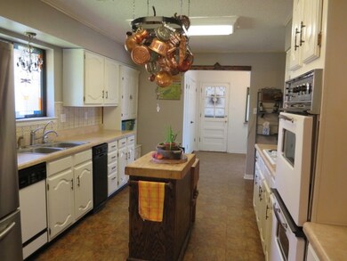 Pretty stained glass window in kitchen, but can be