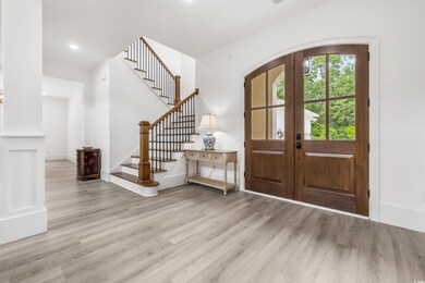 Entrance foyer featuring wood-type flooring and fr