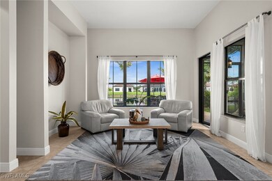 Living area featuring baseboards and light tile pa