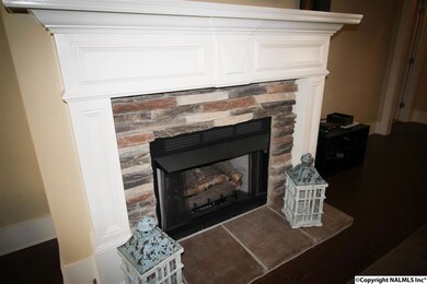 A CLOSE UP OF THE GAS LOG FIRE PLACE IN THE GREAT ROOM!