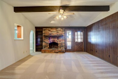 Unfurnished living room with vaulted ceiling with 