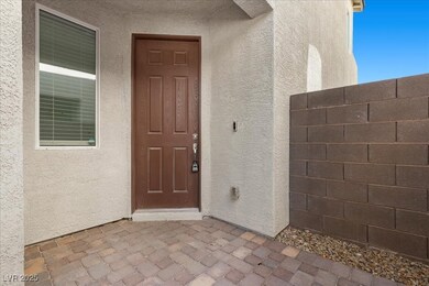 View of exterior entry featuring stucco siding