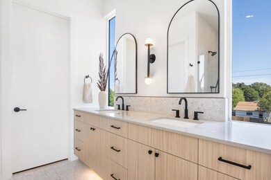 Bathroom featuring double vanity, healthy amount 