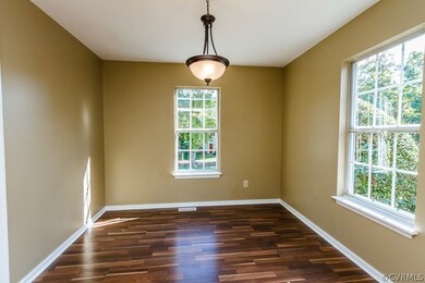 Large dining room, new flooring, new lighting.