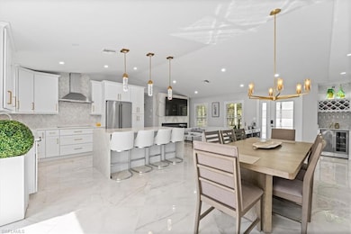 Dining room with light marble finish flooring, lof
