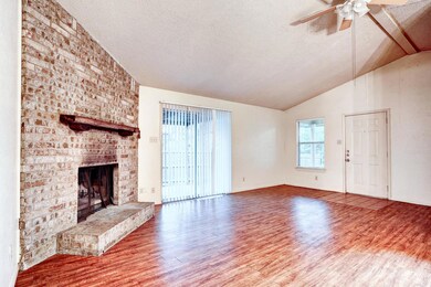 Unfurnished living room featuring lofted ceiling,