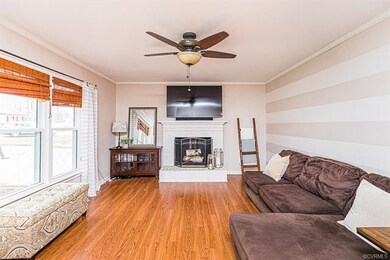 FAMILY ROOM W/ HW FLOORS, CEILING FAN, CROWN, FIRE