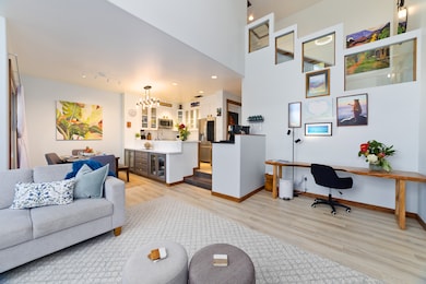 A large living room with elegant and functional furniture (the sectional is a very comfortable trundle bed sleeper) is tastefully decorated. The large living room window is complimented with an automatic window screen.