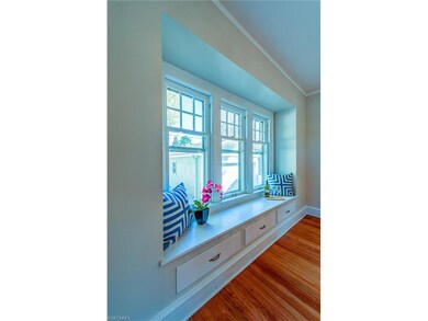Bay windows overlook the yard...