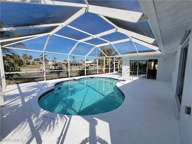 Outdoor pool featuring a patio area and glass encl