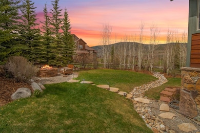 Yard at dusk with a fire pit