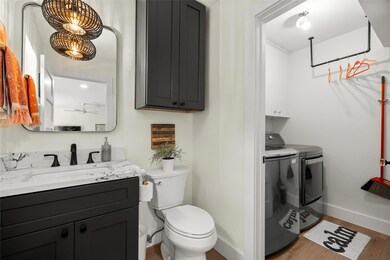 Bathroom featuring vanity, wood finished floors, 