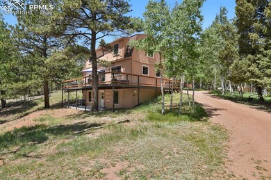 View of property exterior featuring a wooden deck and stucco siding