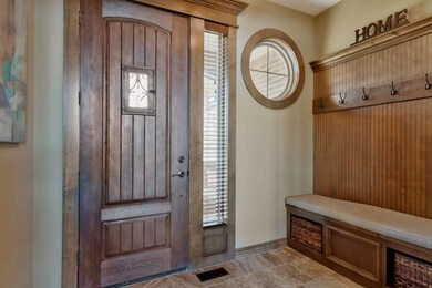 The entryway has custom built locker system for a 