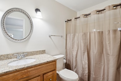 Master bath with  new vanity offers granite top and plenty of storage. Shower and  tub combination and new flooring..