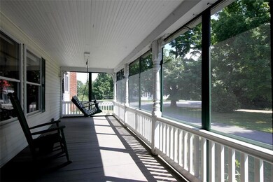 South-facing porch has removable...