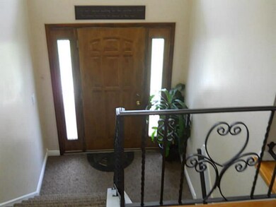 Foyer entrance is classic and features new carpeti