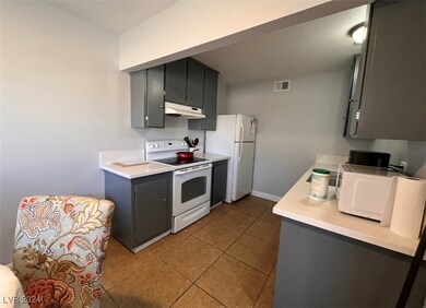 Unit #2 Kitchen with Tile Flooring and Quartz Coun